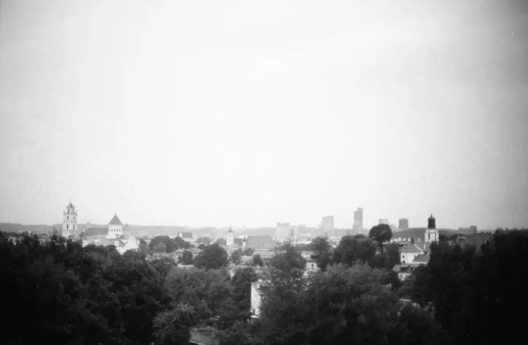 An old style grayscale photo depicting a beautifyl city skyline. Created and photographed by Hiroku