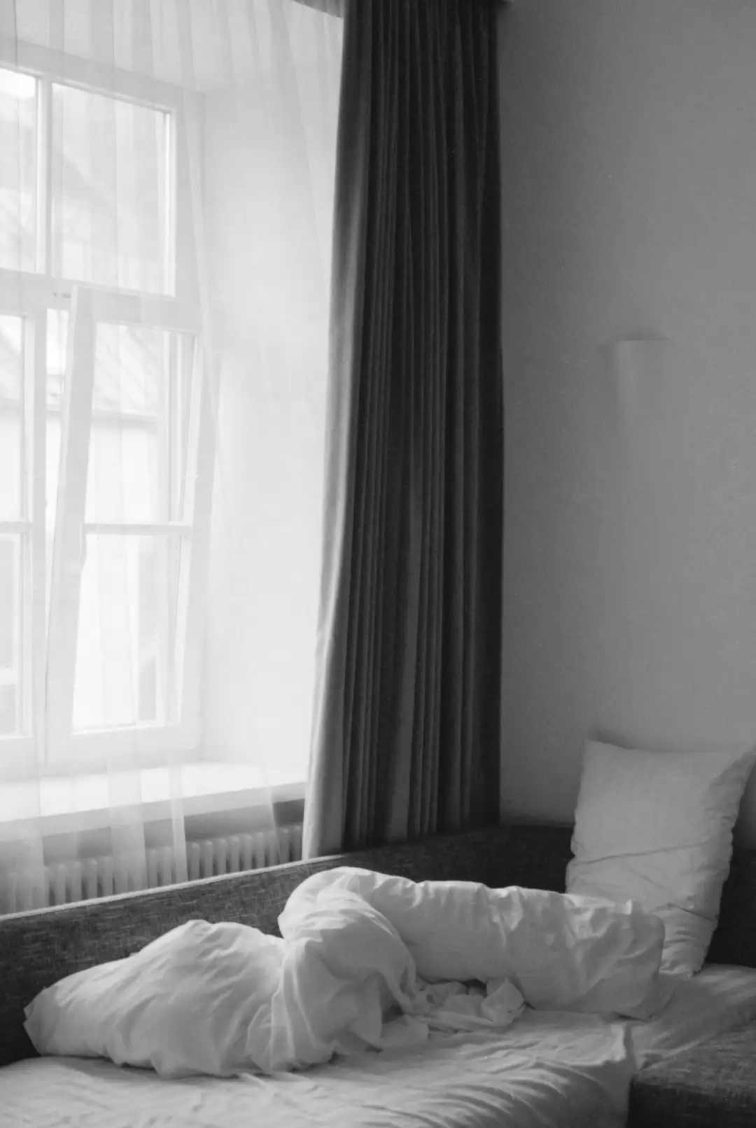 A modern looking sofa bed that is yet to be cleaned. Created and photographed by Hiroku