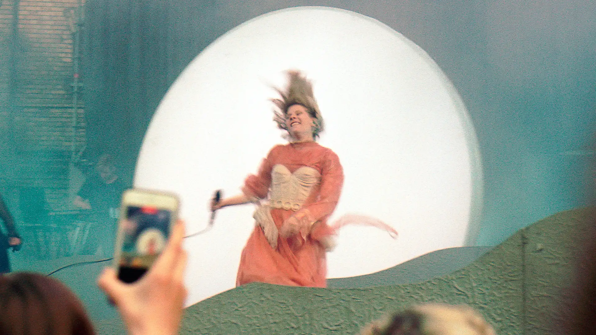 Concert photograph of an artist performing on stage. Created and photographed by Hiroku