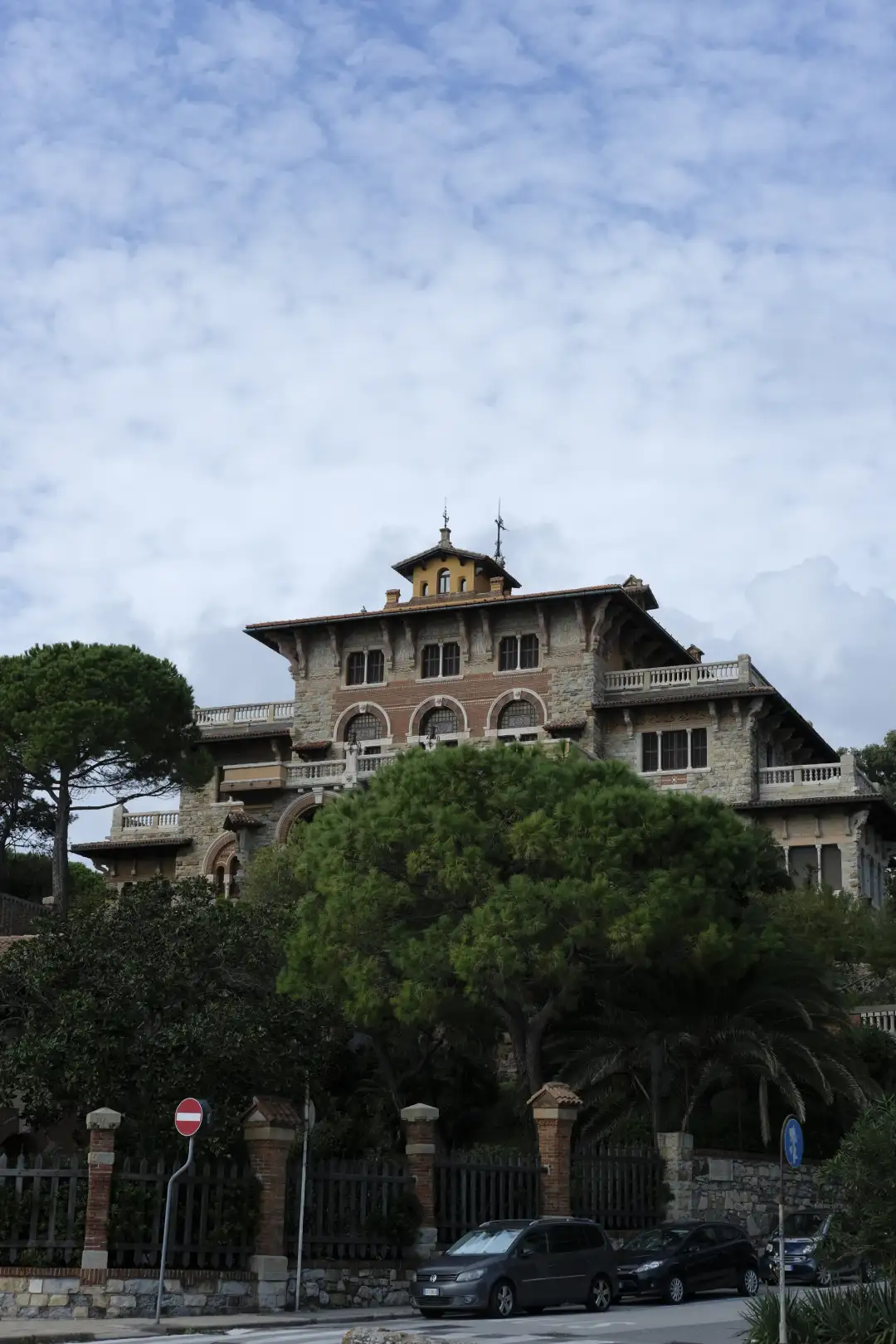 An old fashioned building surrounded by big trees. Created and photographed by Hiroku