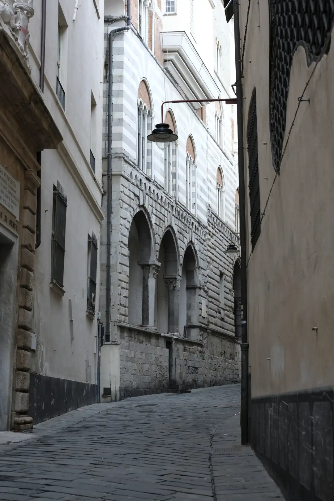 An alleyway leading to the entrance of an interesting looking building. Created and photographed by Hiroku