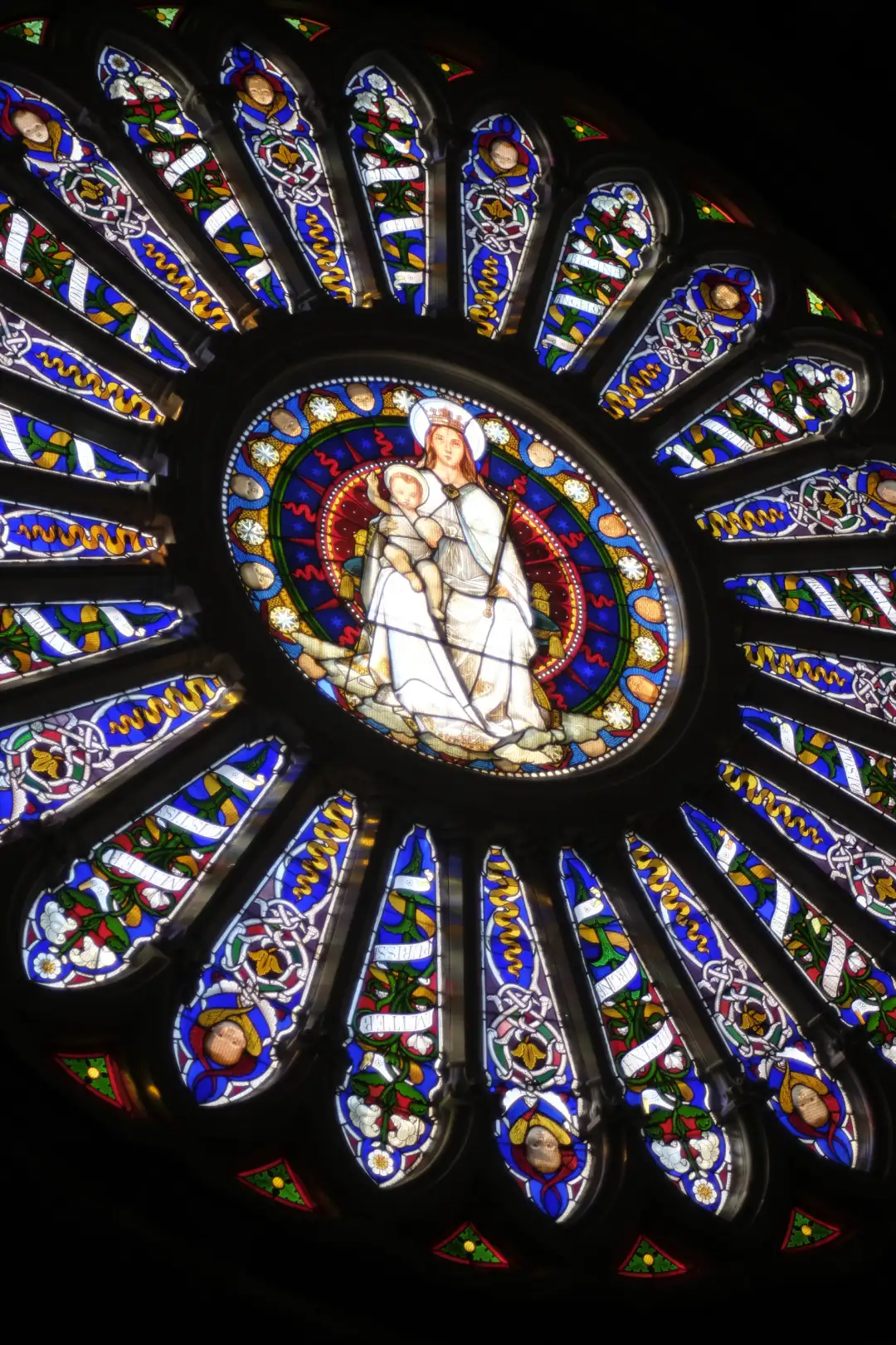 A mosaic of various colored glass that depicts an image. Created and photographed by Hiroku