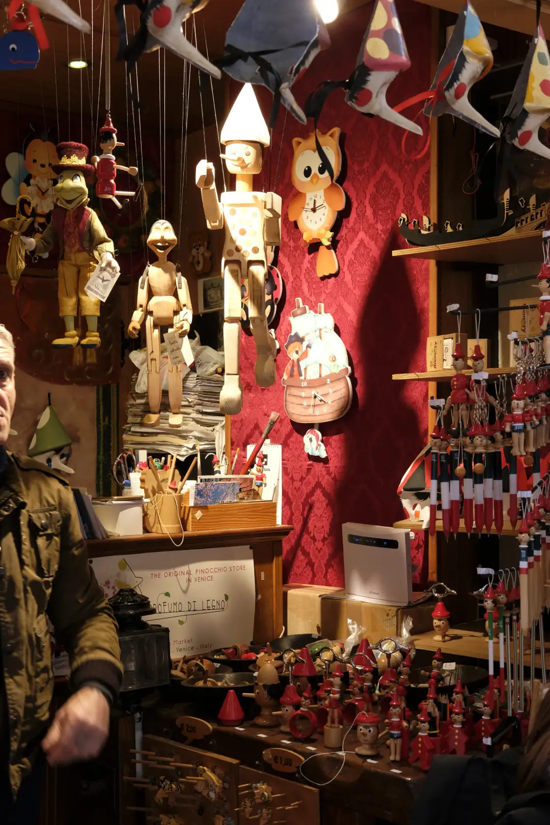 A shop selling a bunch of various little wooden dolls. Created and photographed by Hiroku