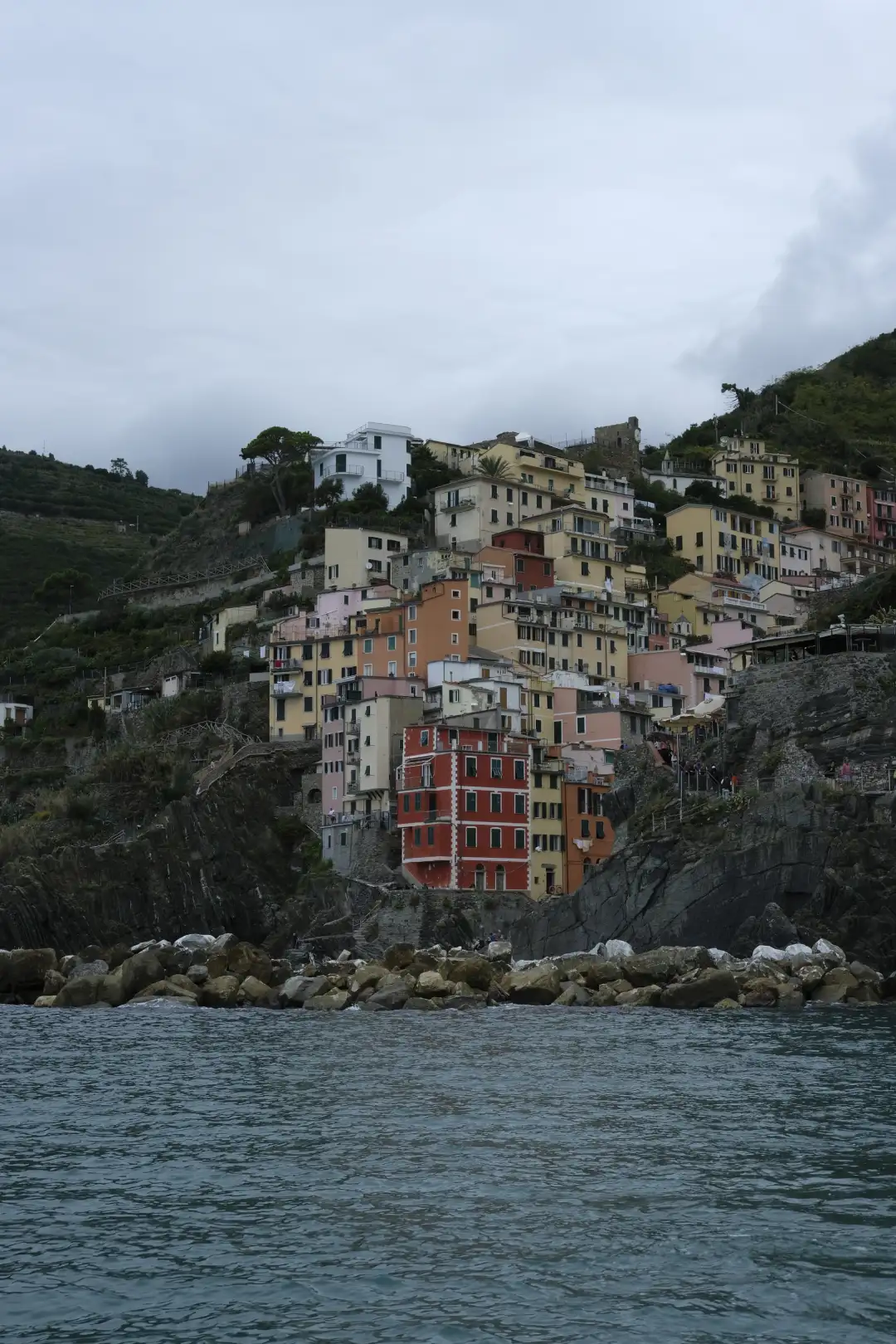 A colorful village set on big cliff overlooking the ocean. Created and photographed by Hiroku