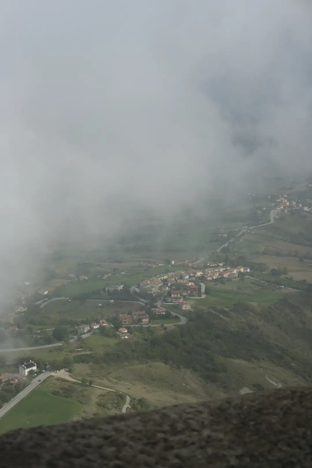A small village photographed from up high above the clouds. Created and photographed by Hiroku